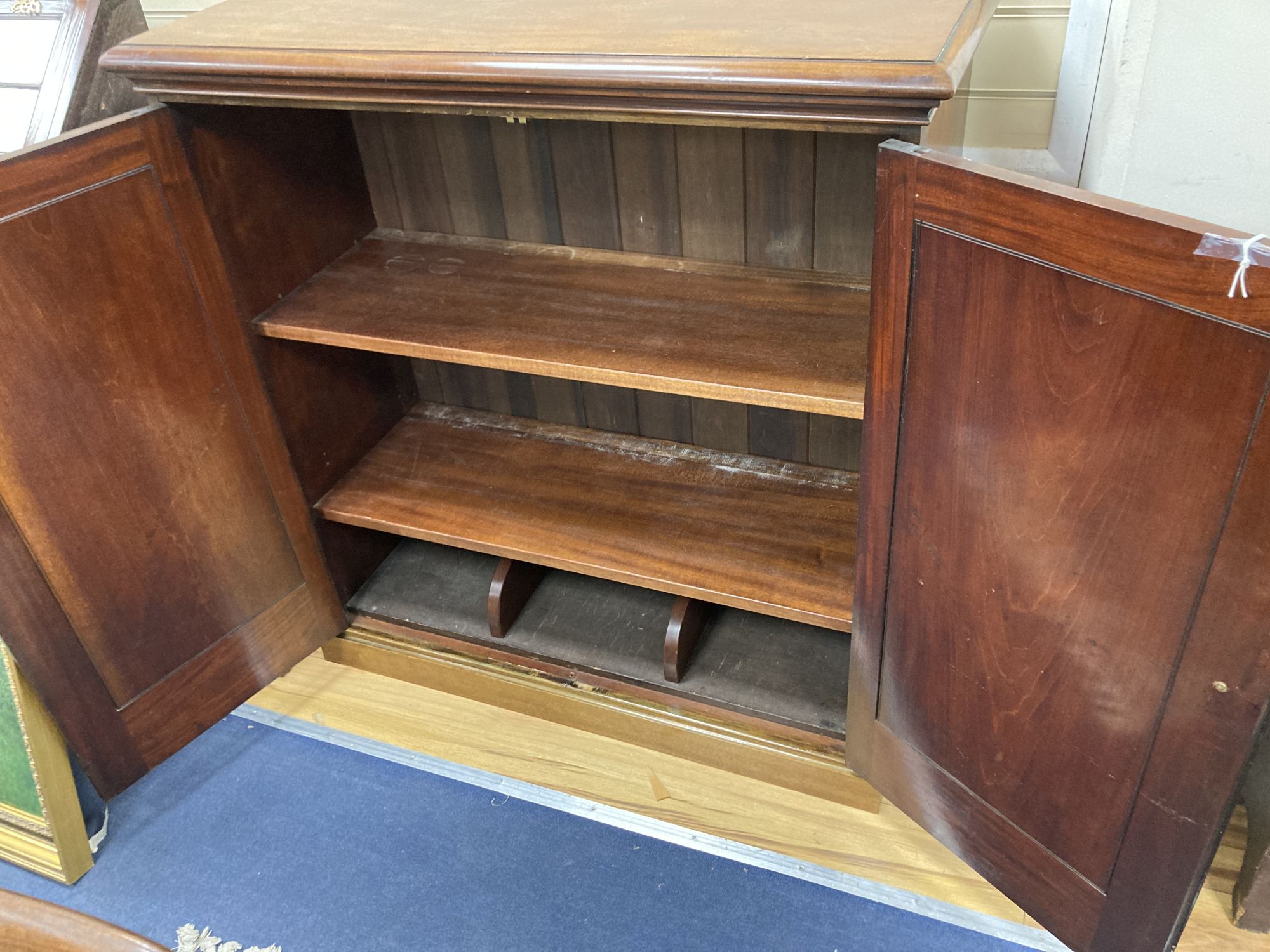 A Victorian mahogany two door cabinet, width 104cm, depth 42cm, height 110cm